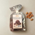 Zartbitter Dinkel Knusperwaffel mit Mandelsplitter bestreut